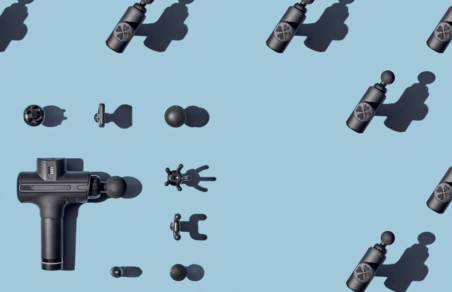 Black massage gun with attachments for effective percussive therapy in muscle recovery