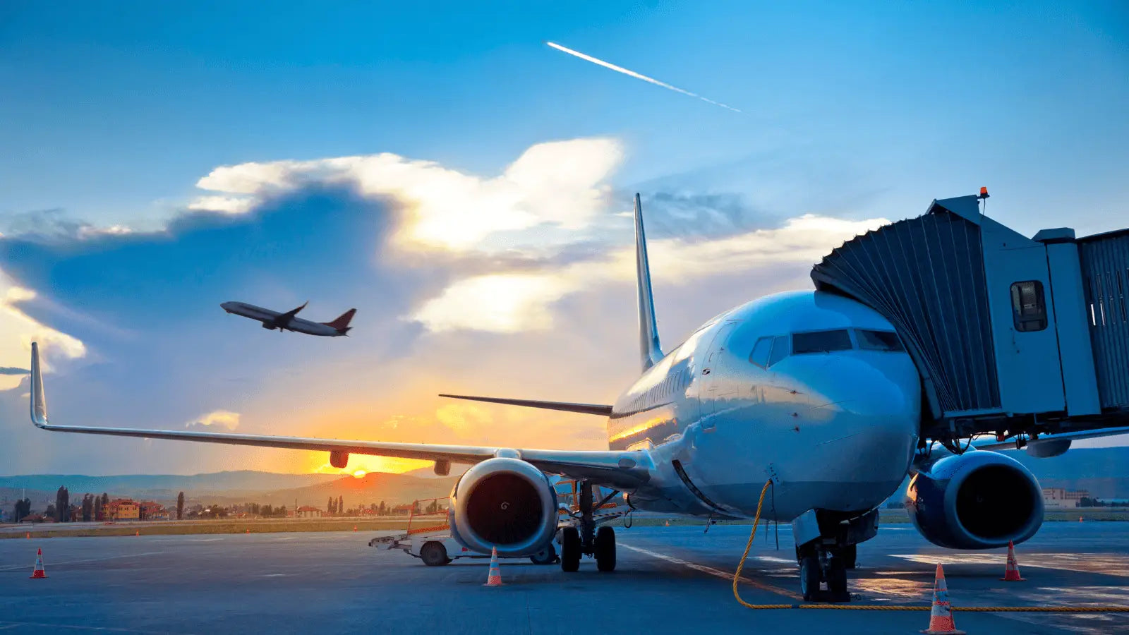 Modern passenger airplane flying, ideal for carrying massage guns in checked luggage