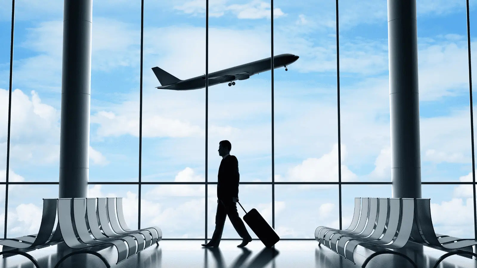 Airport traveler with luggage carrying a massage gun, adhering to TSA guidelines