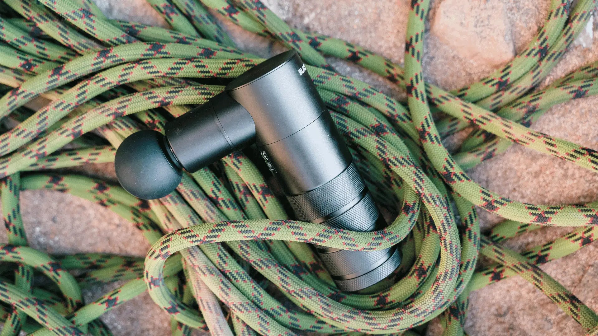 Gray massage gun with power button to avoid damaging during use