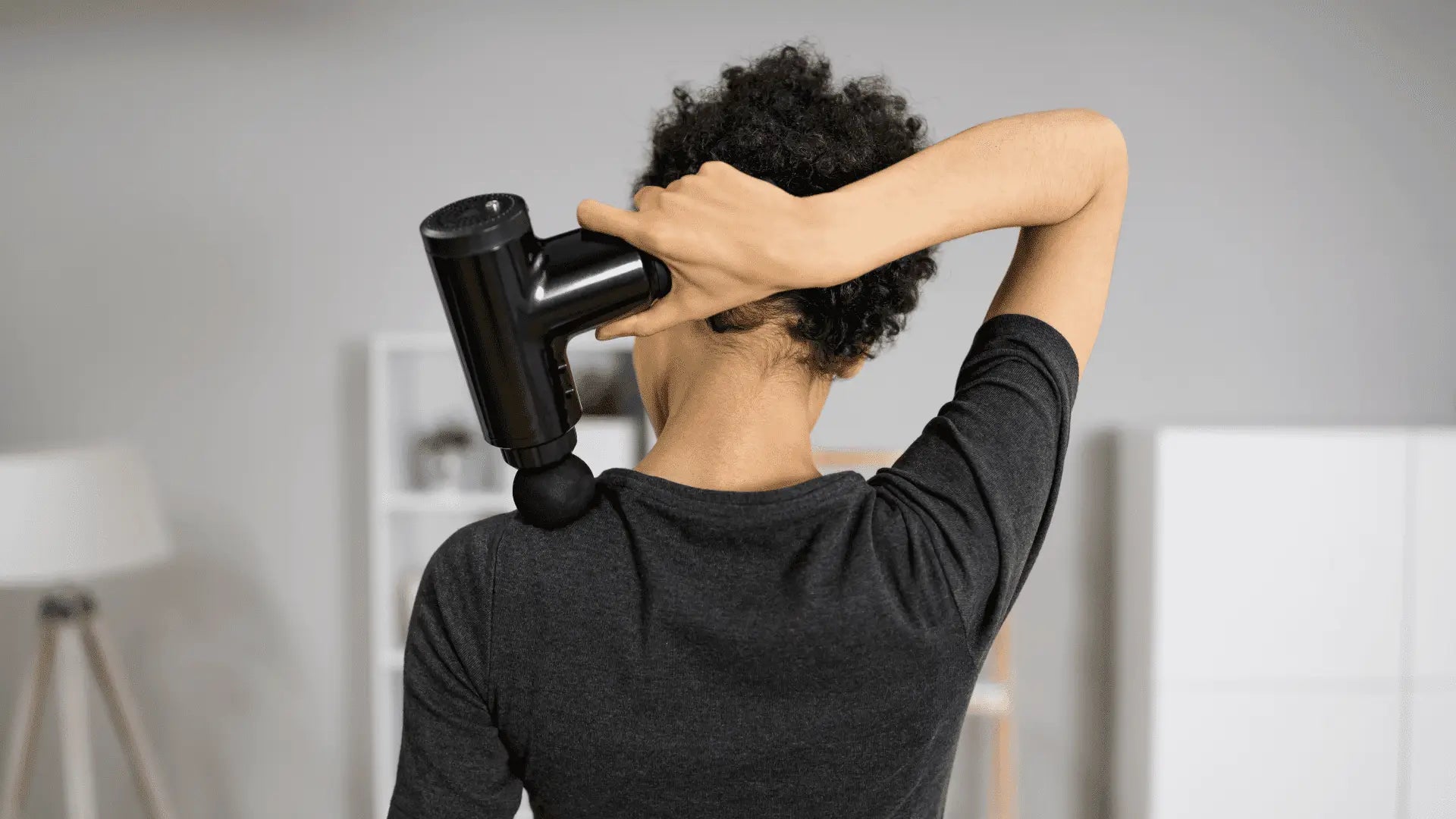 Black massage gun for deep tissue relief, one of the best massage guns for effective recovery