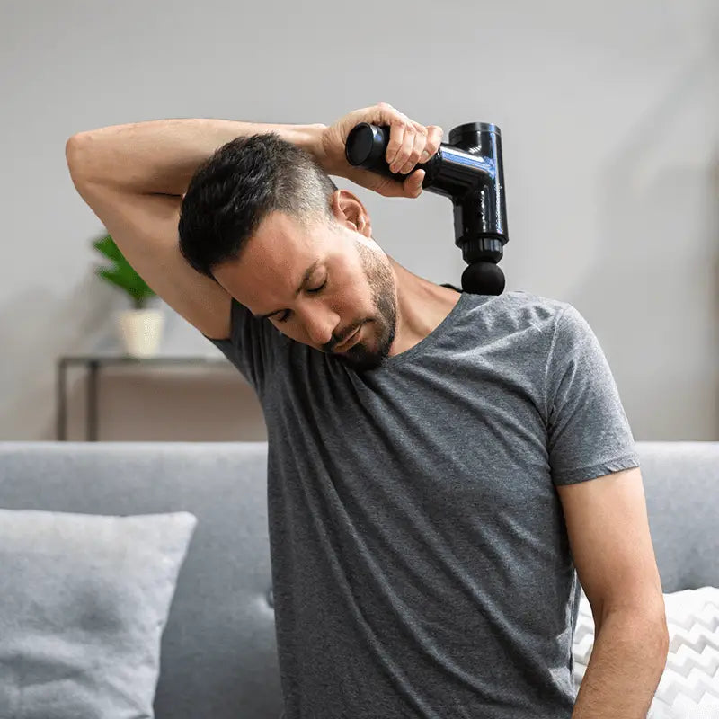 Black massage gun for deep tissue massage and muscle recovery to improve blood flow