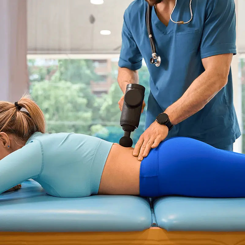 Massage Gun Pro targeting sore muscles with professional gun massage and long battery life