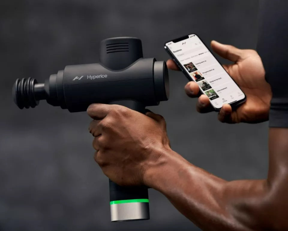 Black Hyperice massage gun with smartphone