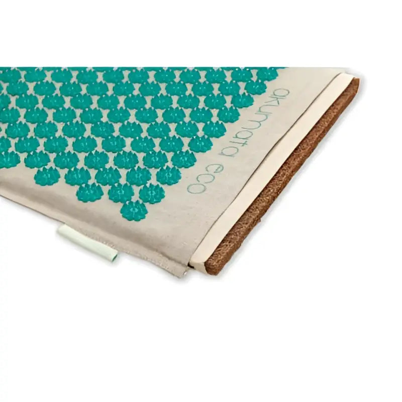 Teal green acupressure mat akumata eco with beige border and cork backing