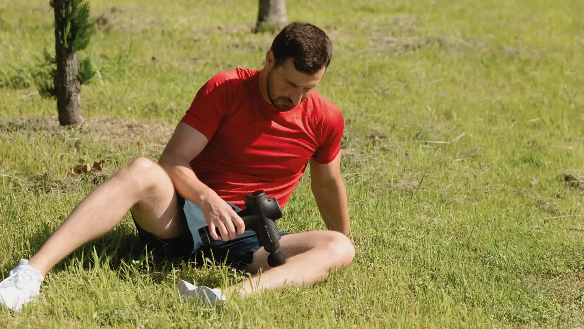 Man using massage gun.