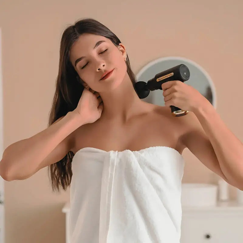 Black and gold Massage Gun for muscle recovery, improve blood flow, soothe sore muscles