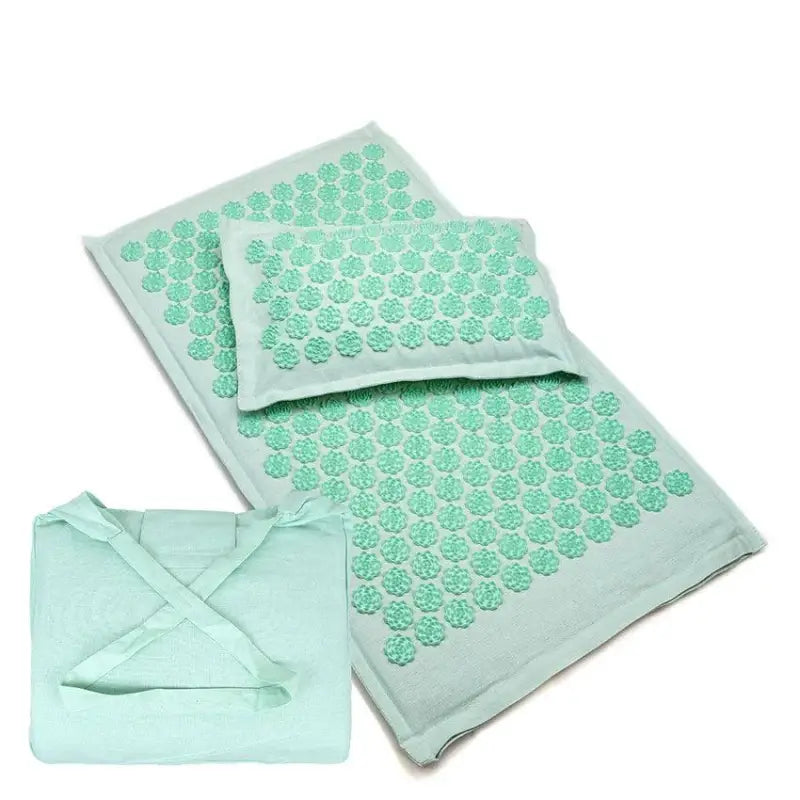Mint green acupressure mat and pillow with floral pressure points